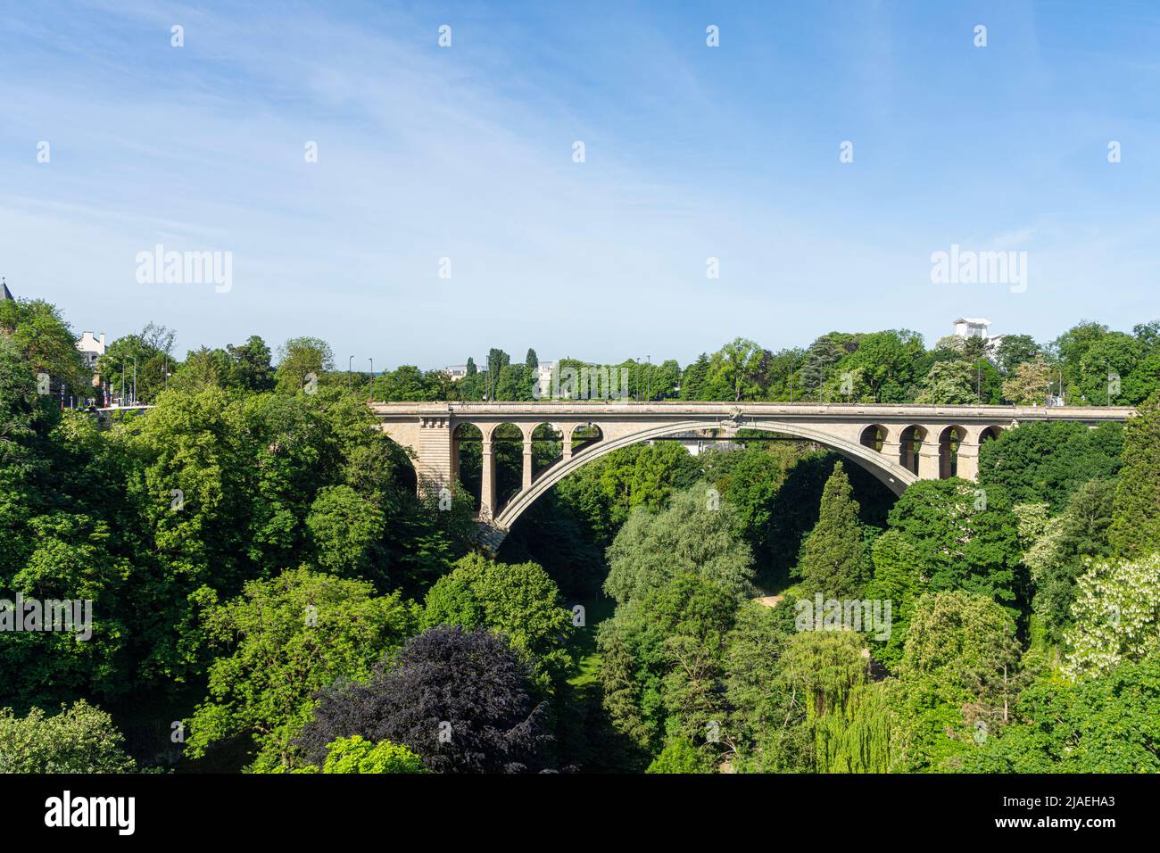 Luxembourg city, May 2022. Pont Adolphe. Stone bridge from the early 1900s with a picturesque view from above and a peaceful park at its foot. Stock Photo