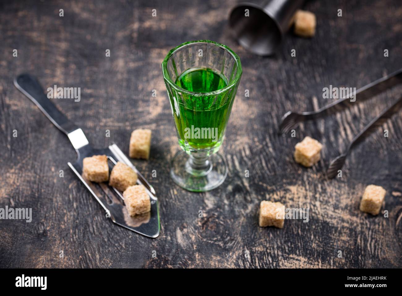 Glass of absinthe with cane sugar Stock Photo - Alamy