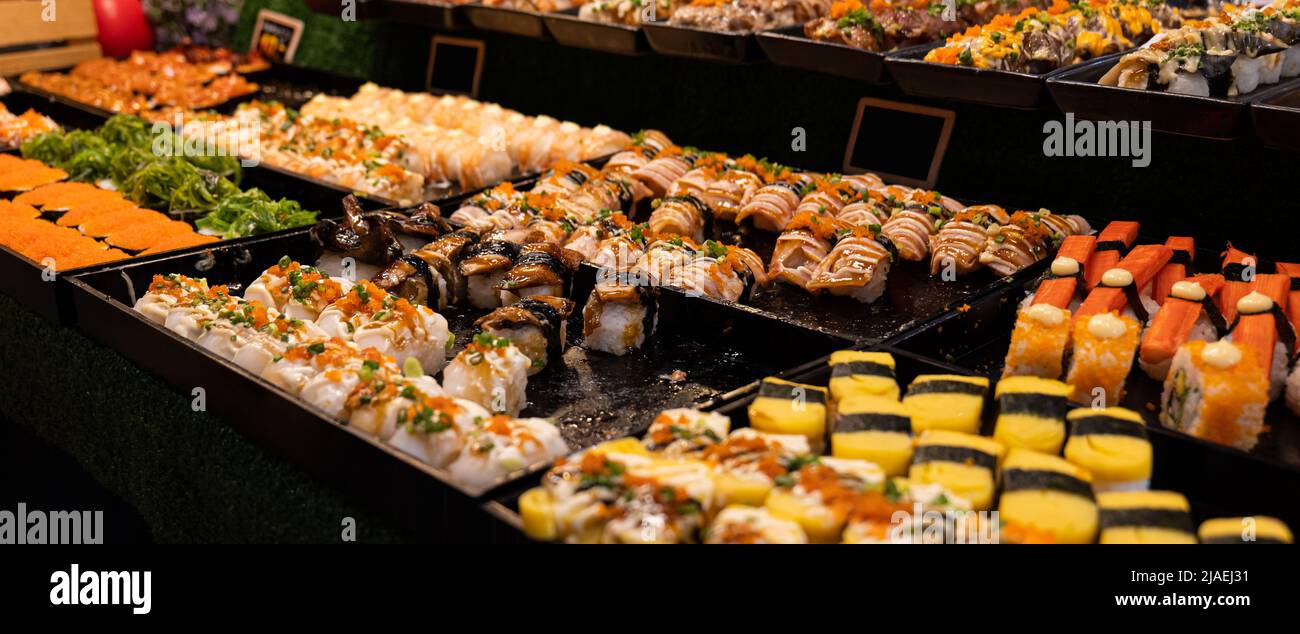 Assorted sushi nigiri and maki set. A variety of Japanese sushi with tuna, crab, salmon and rolls. Japanese food. Stock Photo