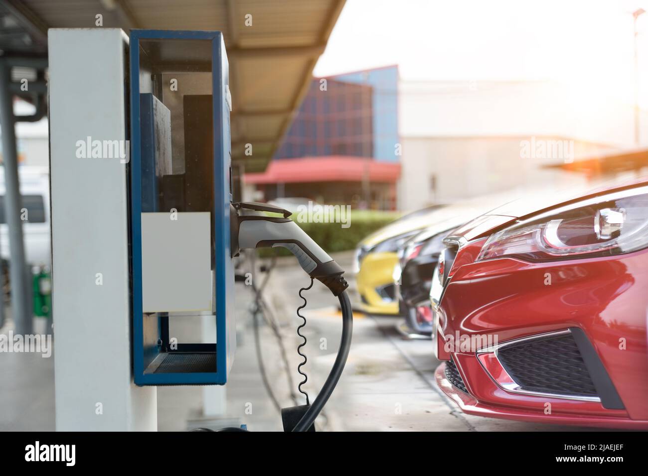 Electric car on electric car charging station. Power supply for electric car charging. Clean energy concept Stock Photo
