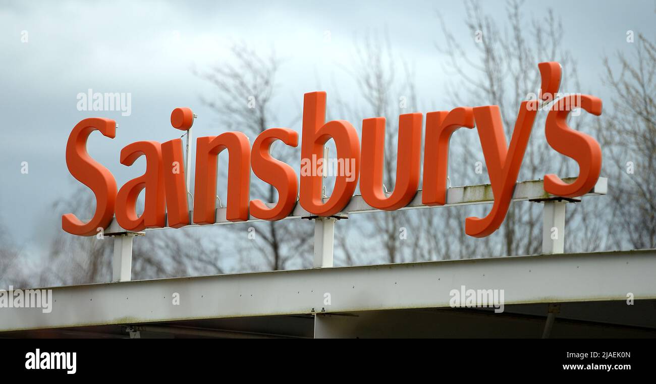 File photo dated 18/3/2014 of a sign for Sainsbury's supermarket. Sainsbury's chief executive Simon Roberts has said the grocery chain will continue to pump funds into offsetting rising costs over the rest of the year as shoppers become 'increasingly concerned' about their finances. The UK's second largest supermarket chain said it will invest more than £500 million into lower pricing by March 2023 as part of a long-term plan focused on value. Issue date: Monday May 30, 2022. Stock Photo