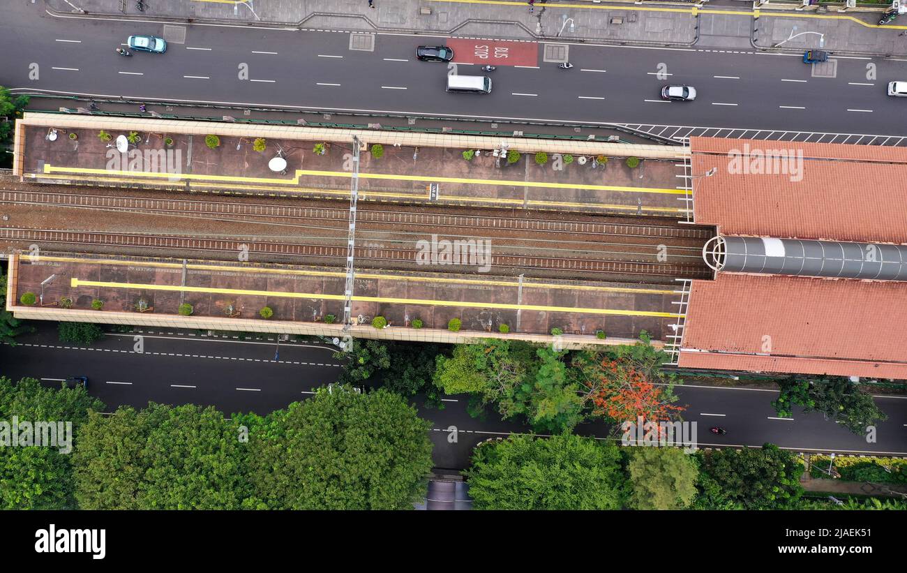 Aerial drone top view of KRL Commuter Line Jabodetabek with JR205 electric train on the track Dipo Depok Depot, West Java, Indonesia Stock Photo