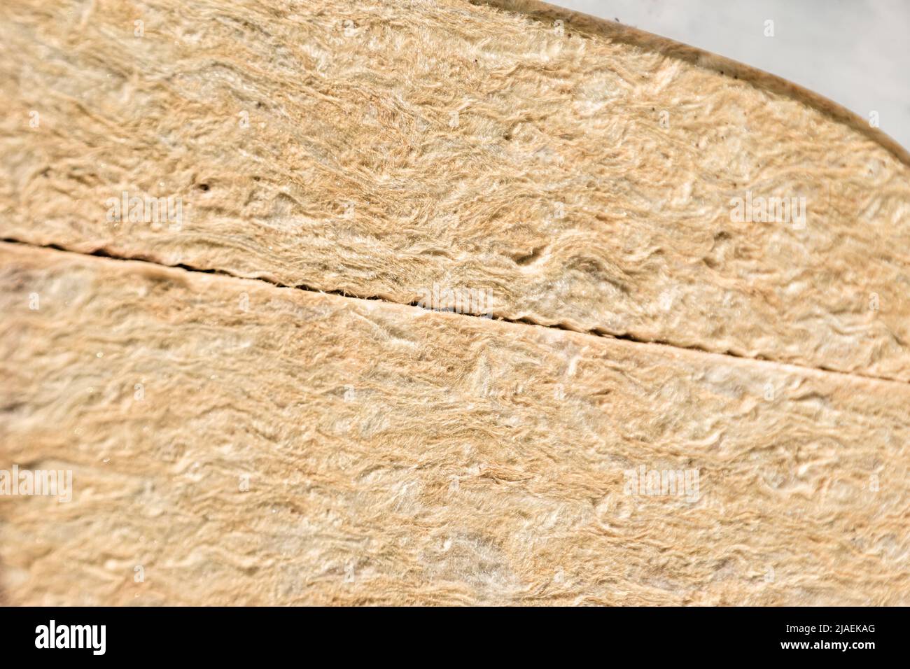 mineral wool or pale yellow glass wool in packaging, selective focus Stock Photo
