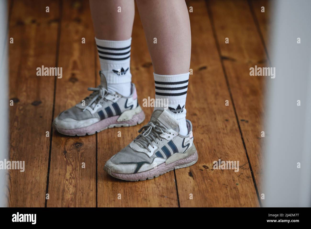 Berlin, Germany. 27th May, 2022. Socks adidas brand are worn in adidas  sneakers. Short socks were in for years. This year, anyone who thinks  anything of themselves is wearing more fabric with