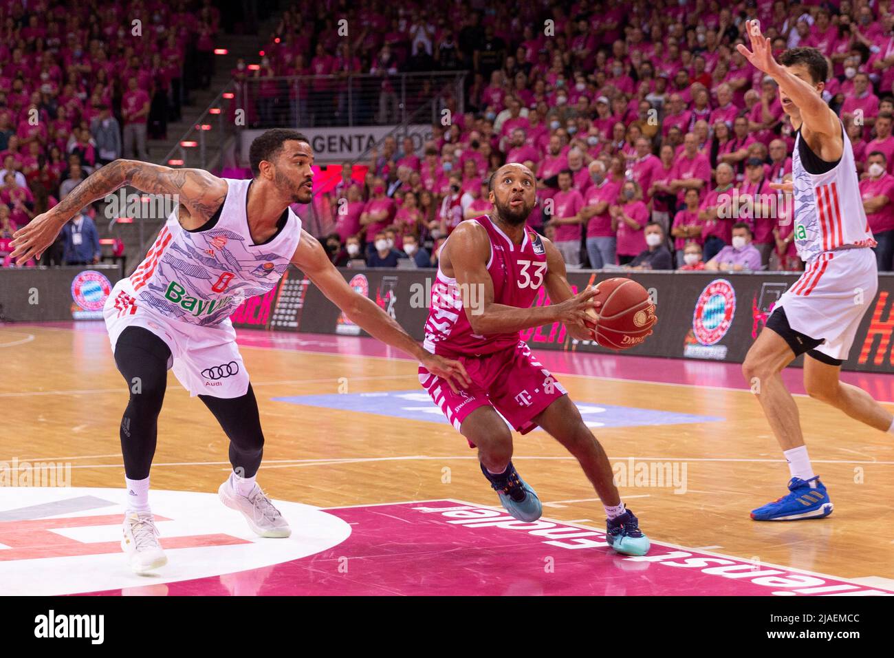 Bonn, Deutschland. 28th May, 2022. Parker JACKSON-CARTWRIGHT (BN, re.) on the ball, in duels versus Nick WEILER-BABB (FCB, left.) and Vladimir LUCIC (FCB, re.), action. Final score 68:80. Basketball 1.Bundesliga/Telekom Baskets Bonn-FC Bayern Munich/1. Semi-final playoff, in the TELEKOMDOME, on May 28th, 2022 Â Credit: dpa/Alamy Live News Stock Photo