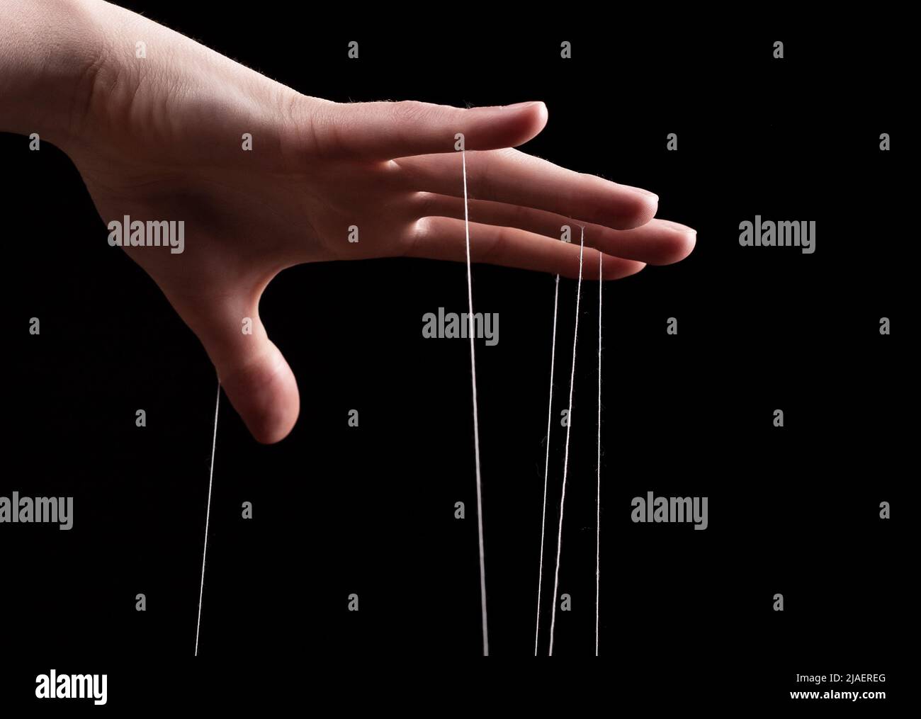 Woman hand with strings on fingers. Victim of domestic violence