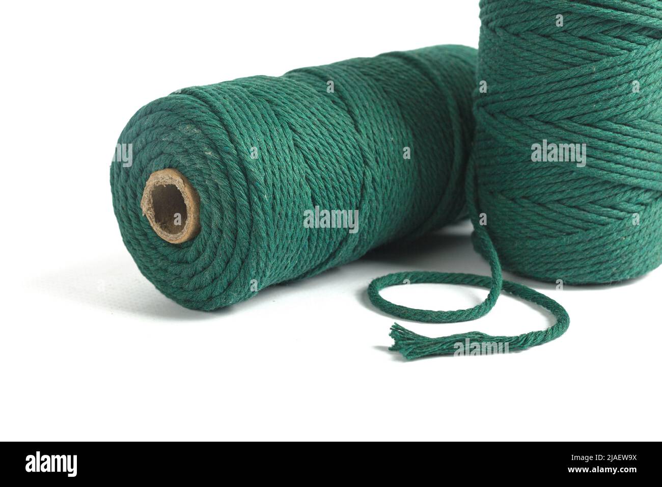 Set of Two Green Color skein single strand Cotton cord rope for macrame on  white. Use for DIY handcraft. Closeup Textile bobbin reel Stock Photo -  Alamy