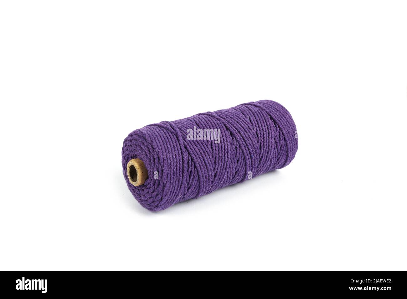 Purple Color Skein single strand Cotton cord rope for macrame on white. Use  for DIY handcraft. Closeup Textile bobbin reel Stock Photo - Alamy