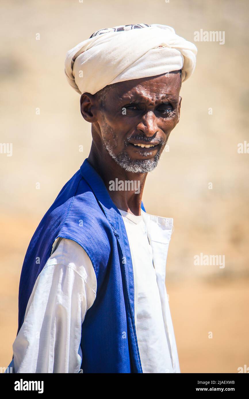 Old Man in traditional Clothes on the street Stock Photo - Alamy