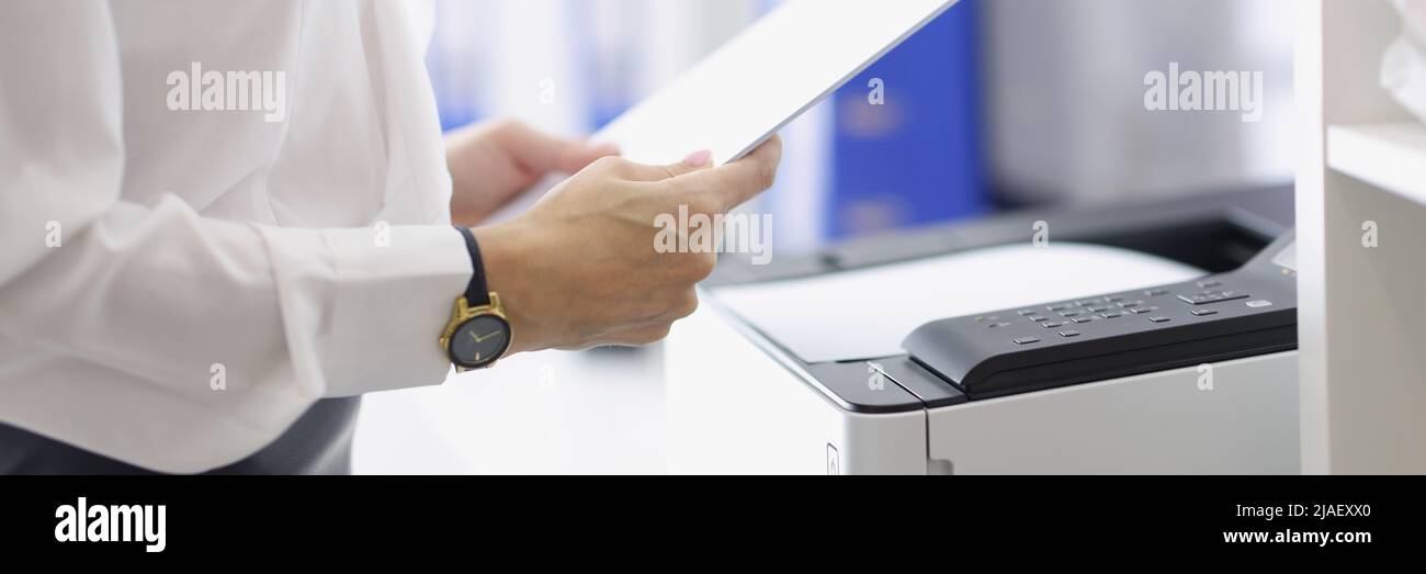 Woman working with papers in office Stock Photo