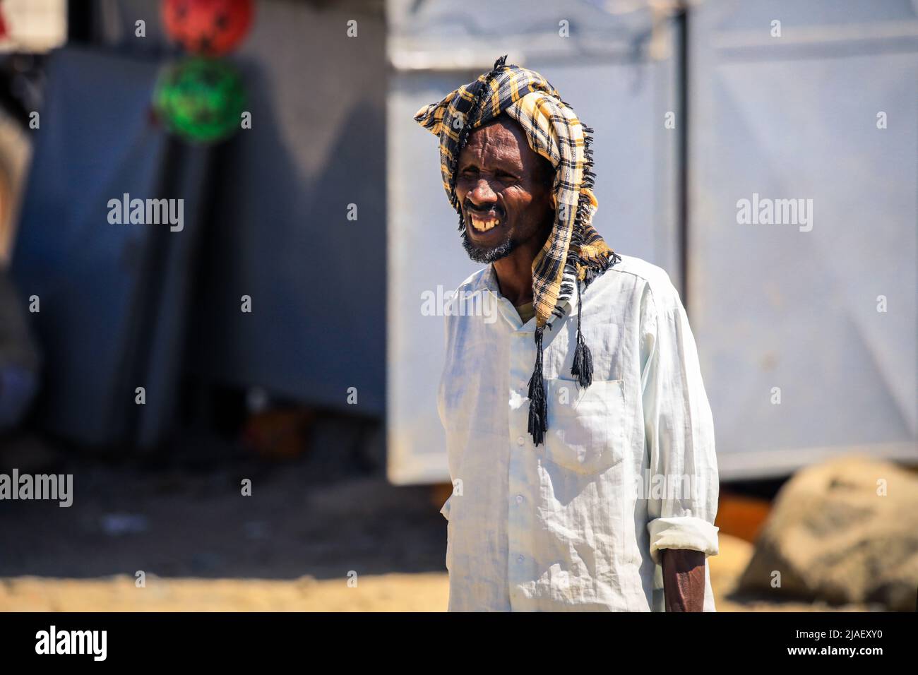 Old Man in traditional Clothes on the street Stock Photo - Alamy
