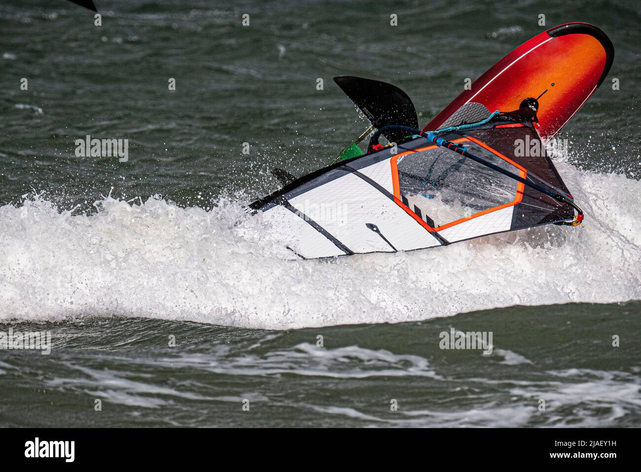 Close up of a wind foil board capsized in a wave Stock Photo
