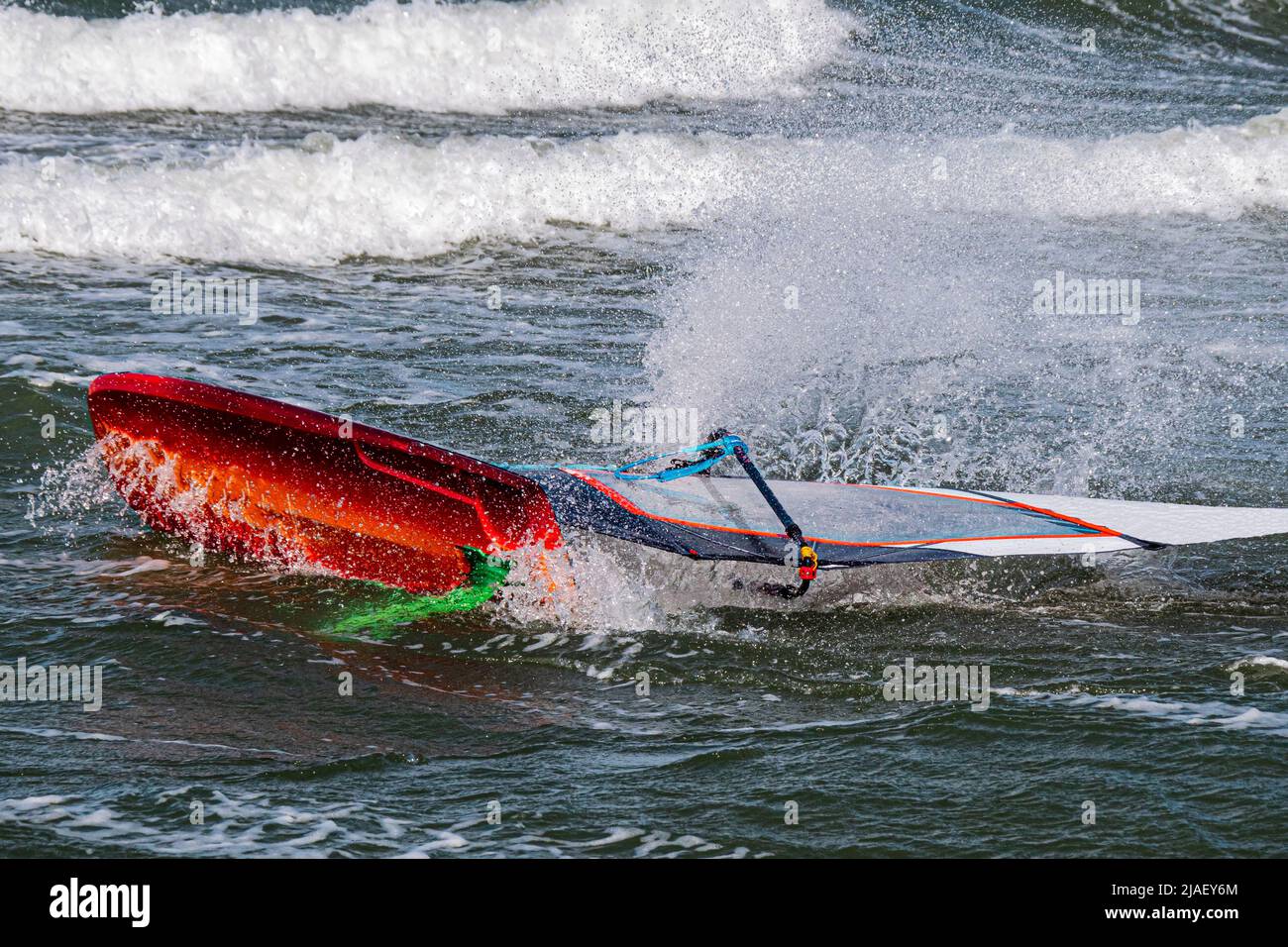 Close up of a wind foil board capsized in a wave Stock Photo