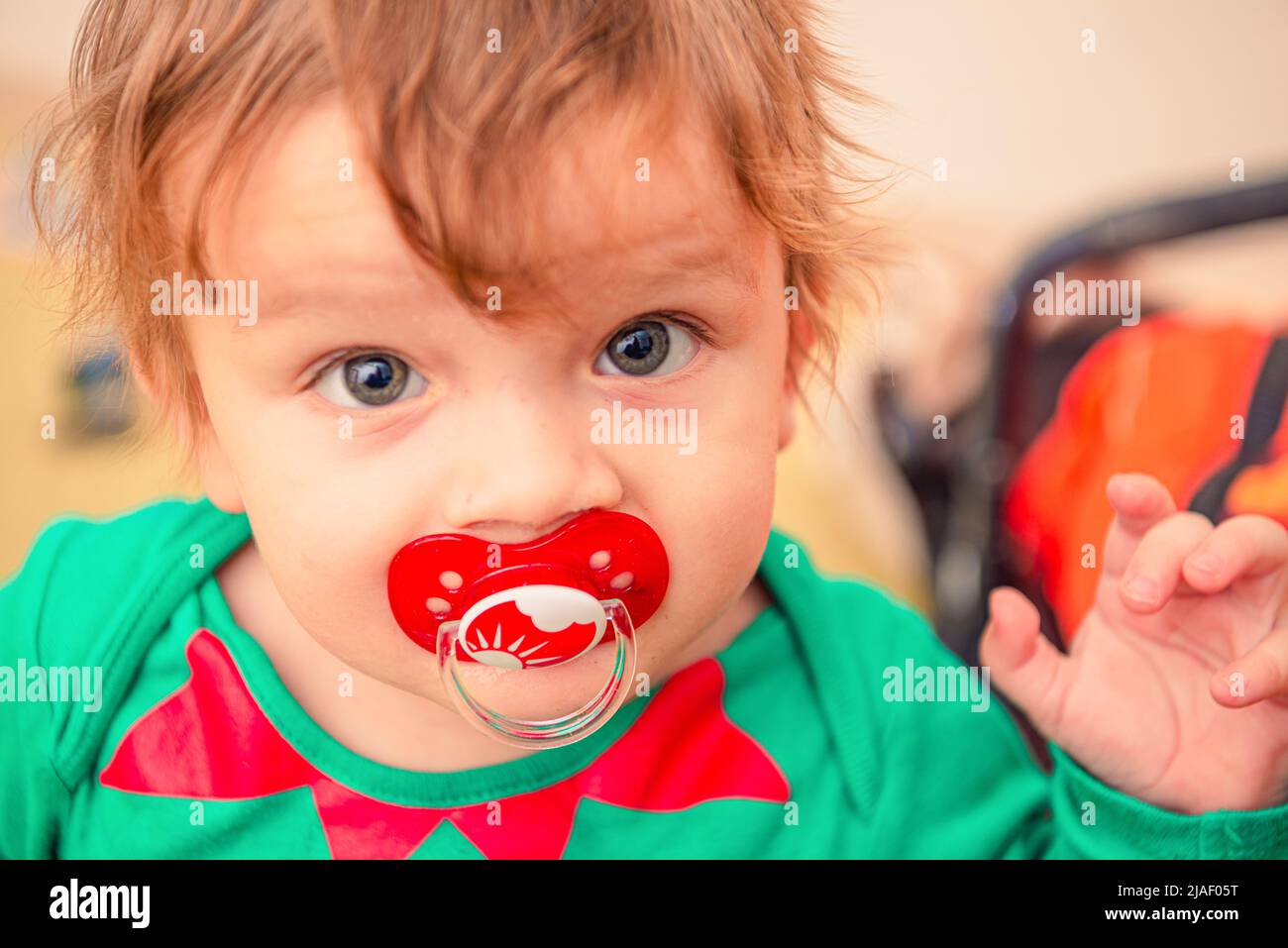Boy sucking a pacifier hires stock photography and images Alamy