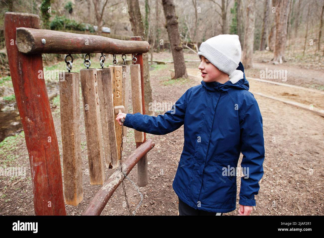 Boy  playing on a wooden xylophone at Znojmo park in Czech Republic Stock Photo