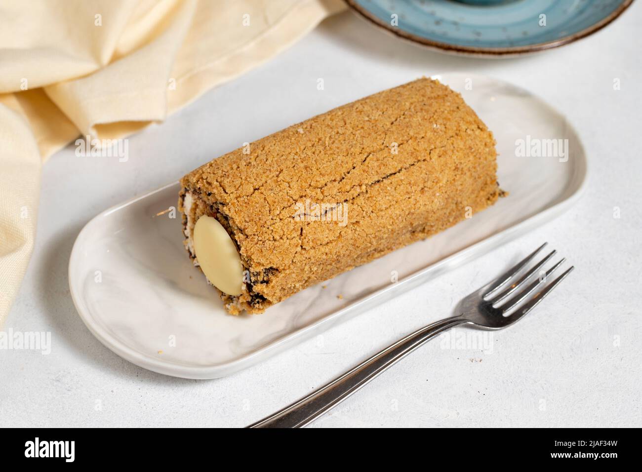 Banana roll cake. Chocolate and banana cake on a white background. close up Stock Photo