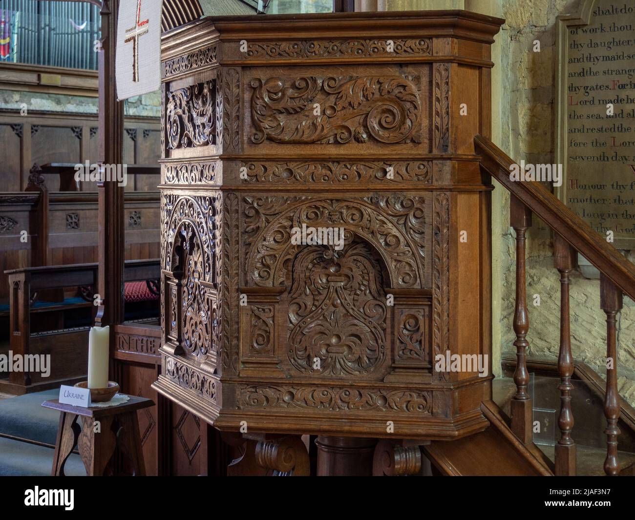 Carved wooden pulpit, interior of the parish church of St Michael and All Angels in the town of Broadway, Cotswolds, Worcestershire, UK Stock Photo
