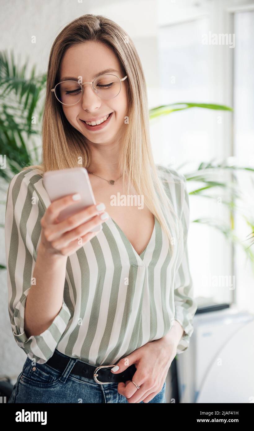 Young woman working on a computer in her office Stock Photo - Alamy