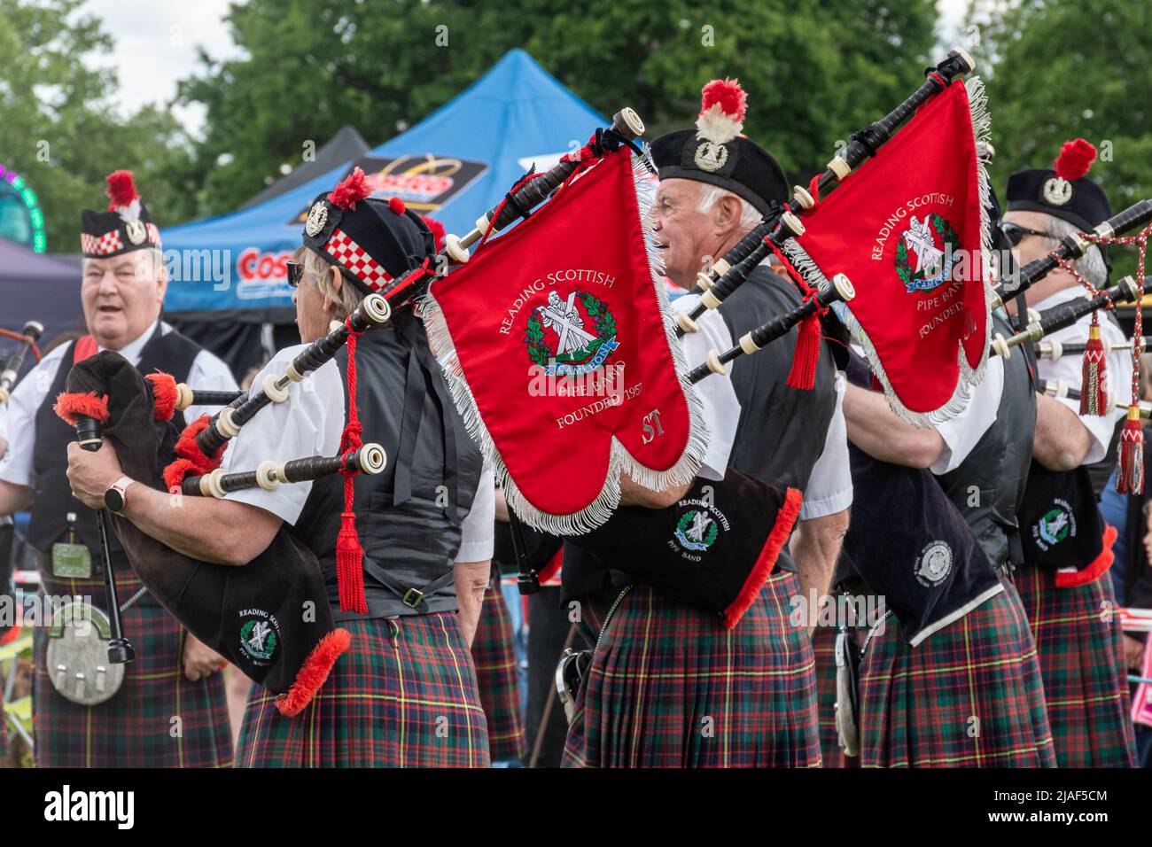 Reading Scottish Pipe Band entertaining people at an event in