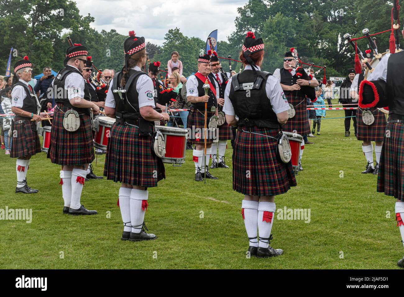 Reading Scottish Pipe Band entertaining people at an event in