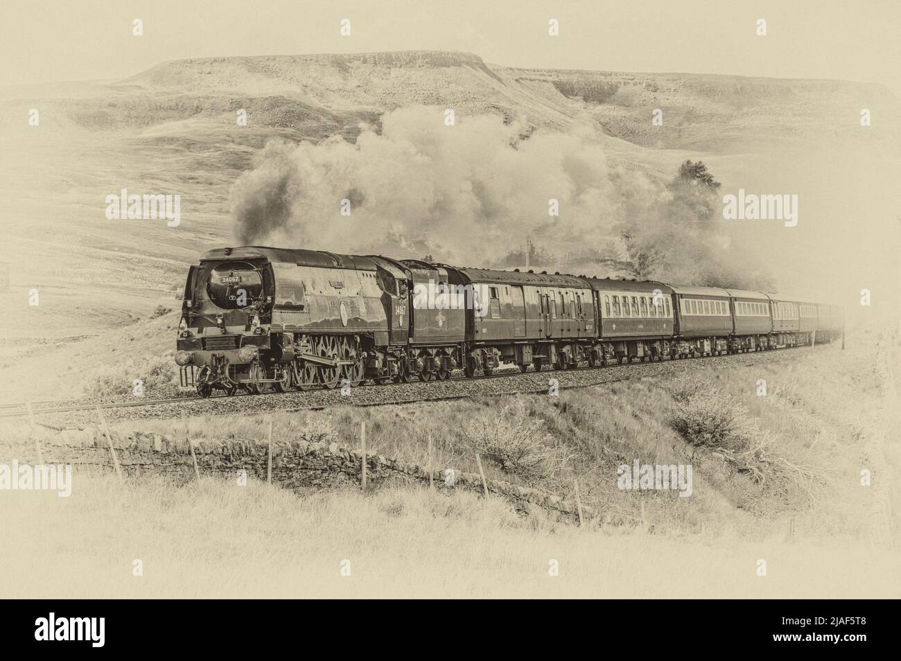 The image is of the Southern Railways Battle of Britain Class 4-6-2 #34067 Tangmere after passing through Ais Gill summit en-route to Garsdale station Stock Photo