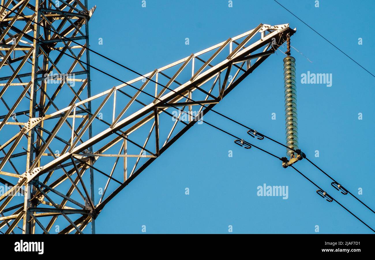 Power line on blue sky close-up. Mast energy electricity Stock Photo