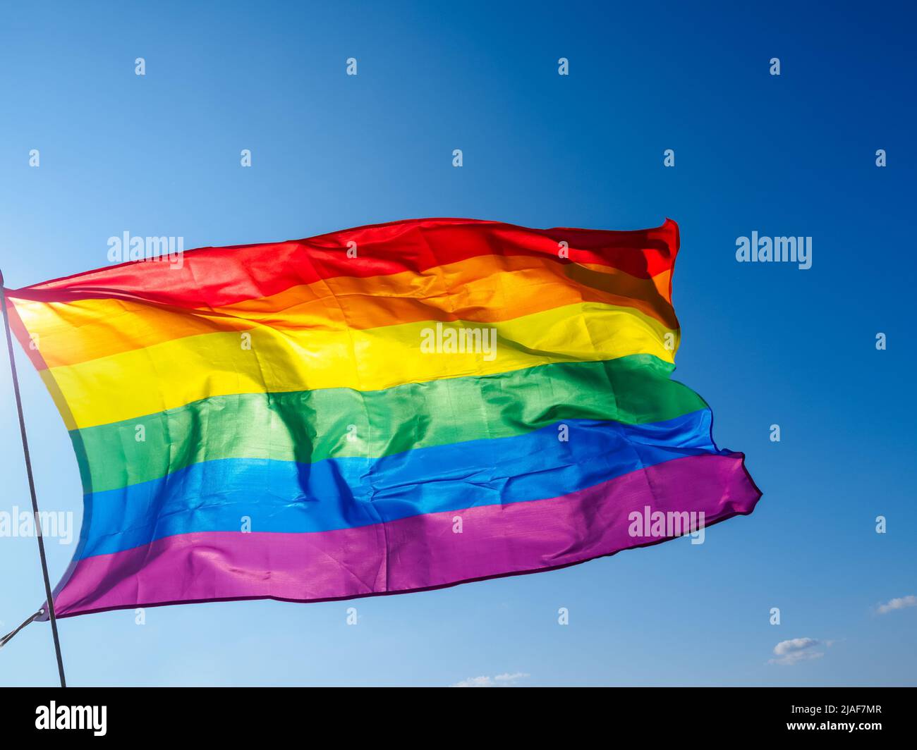 Pride month waving rainbow flag hi-res stock photography and images - Alamy