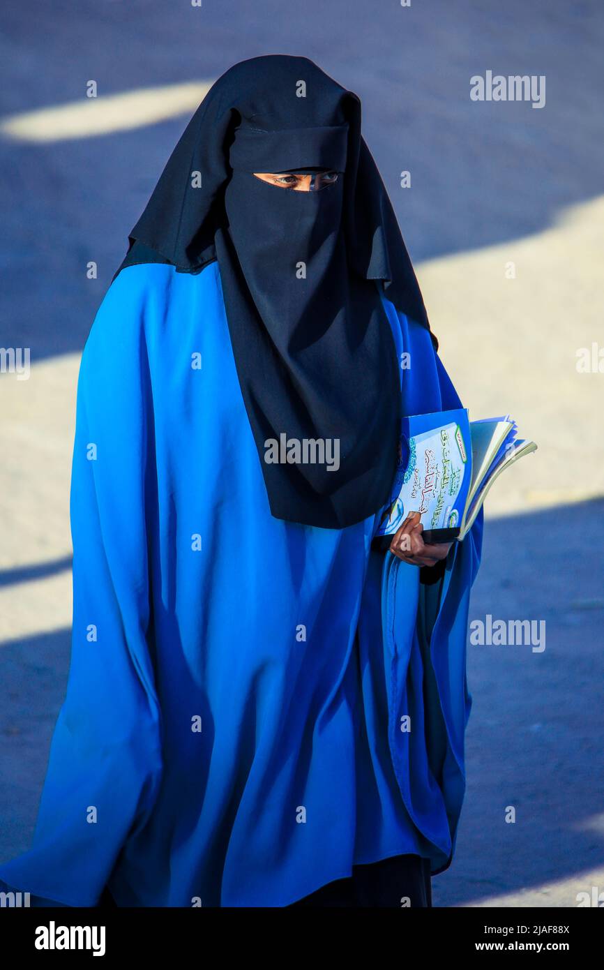 Muslim Woman in Hijab walking on the Capital Streets Stock Photo