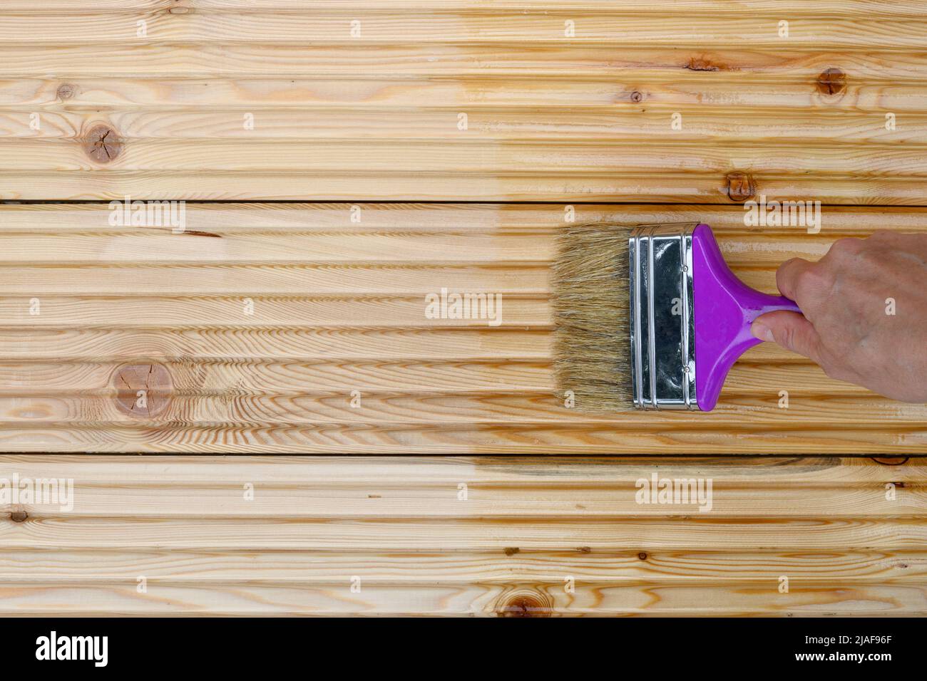 Painting new wooden boards for patio by special waterproof protective