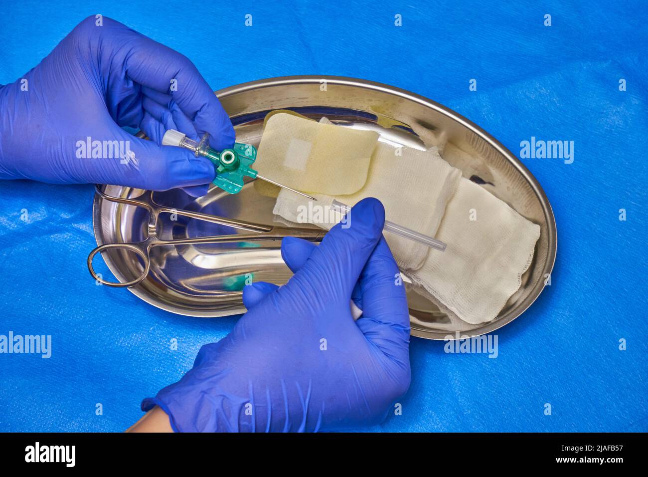 Intravenous infusion. Intravenous catheter in the hands of a doctor