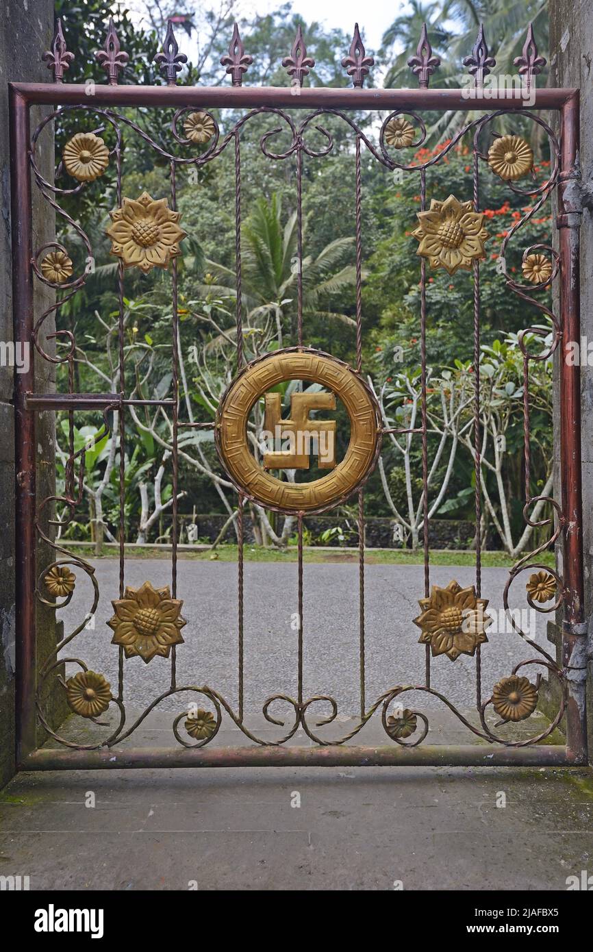 gate with swastika at water temple of Tirta Empul, Indonesia, Bali Stock Photo