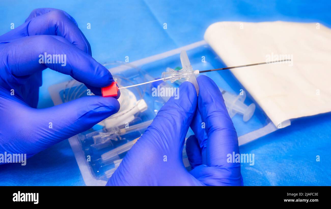 Needle for epidural anesthesia. Tuohy needle in doctor's hands. Soft