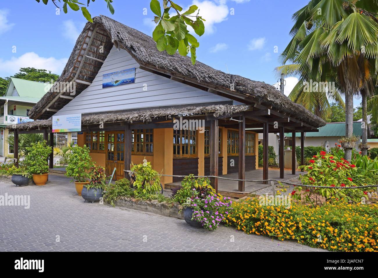 Tourist office at the harbour of La Passe on the island La Digue, Seychelles Stock Photo