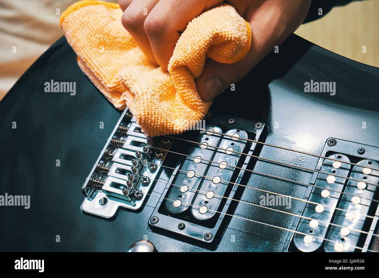 Musical instrument care. Cleaning the electric guitar Stock Photo Alamy