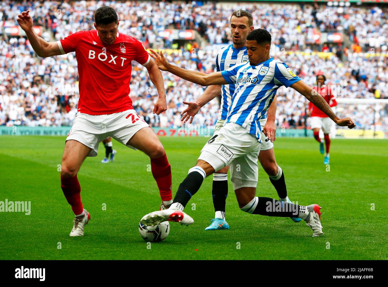 LONDON, ENGLAND - MAY 29: L-R Scott McKenna of Nottingham Forest gets ...