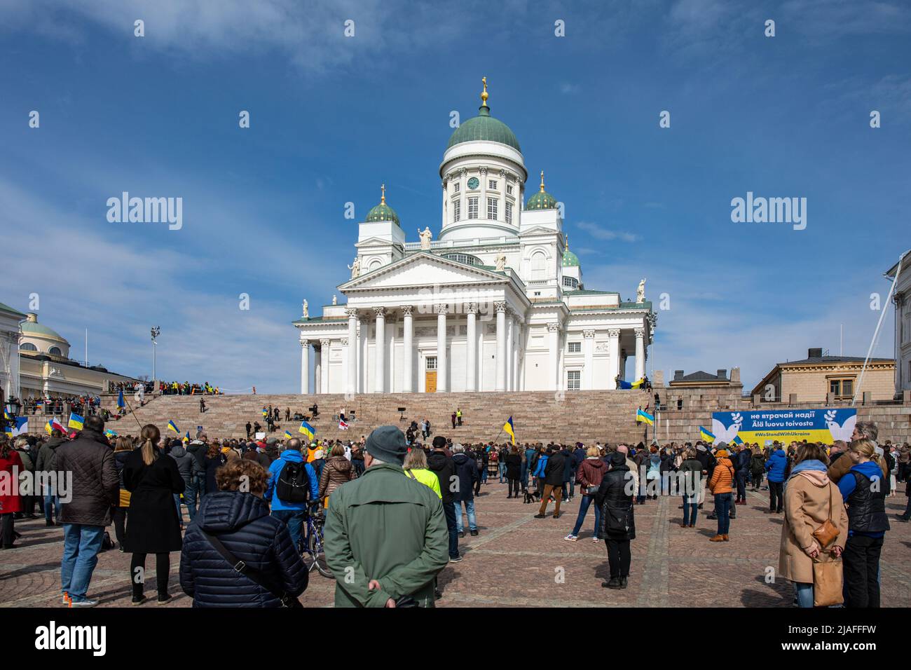 People on Senate Square at Vapaa Ukraina - vapaa maailma demonstration in support of Ukraine in Helsinki, Finland Stock Photo