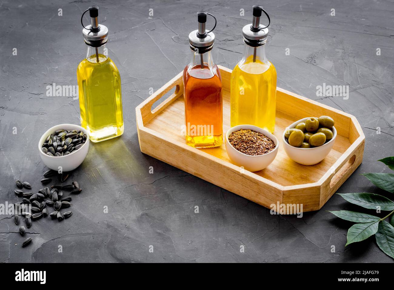 Cooking oil in bottles. Sunflower olive and sesame oil with ingredients