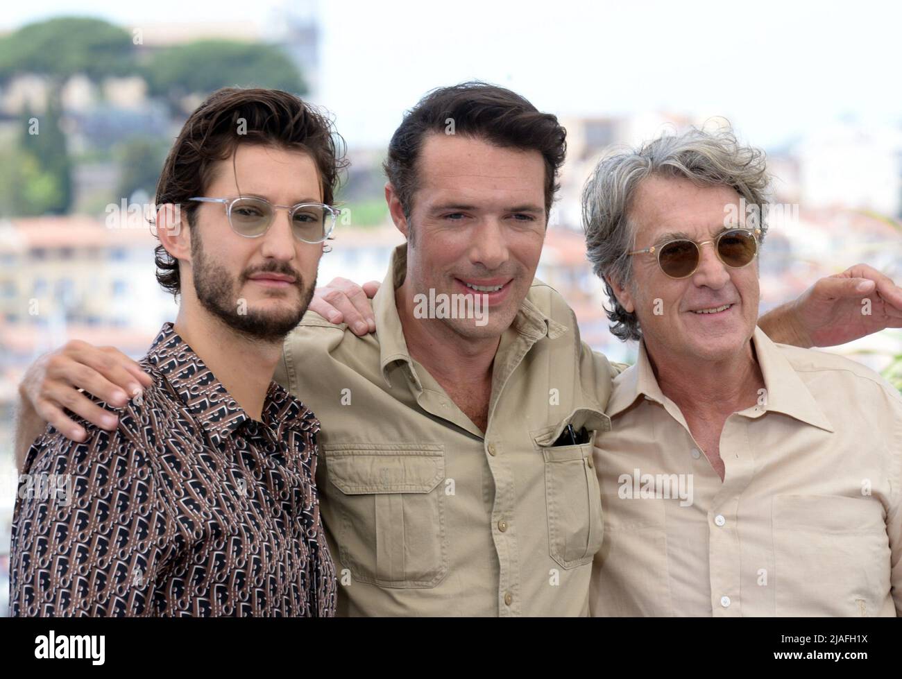 May 28, 2022, CANNES, France: CANNES, FRANCE - MAY 28: Pierre Niney, Nicolas Bedos and FranÃ§ois Cluzet attend the photocall for ''Mascarade'' during the 75th annual Cannes film festival at Palais des Festivals on May 28, 2022 in Cannes, France. (Credit Image: © Frederick Injimbert/ZUMA Press Wire) Stock Photo