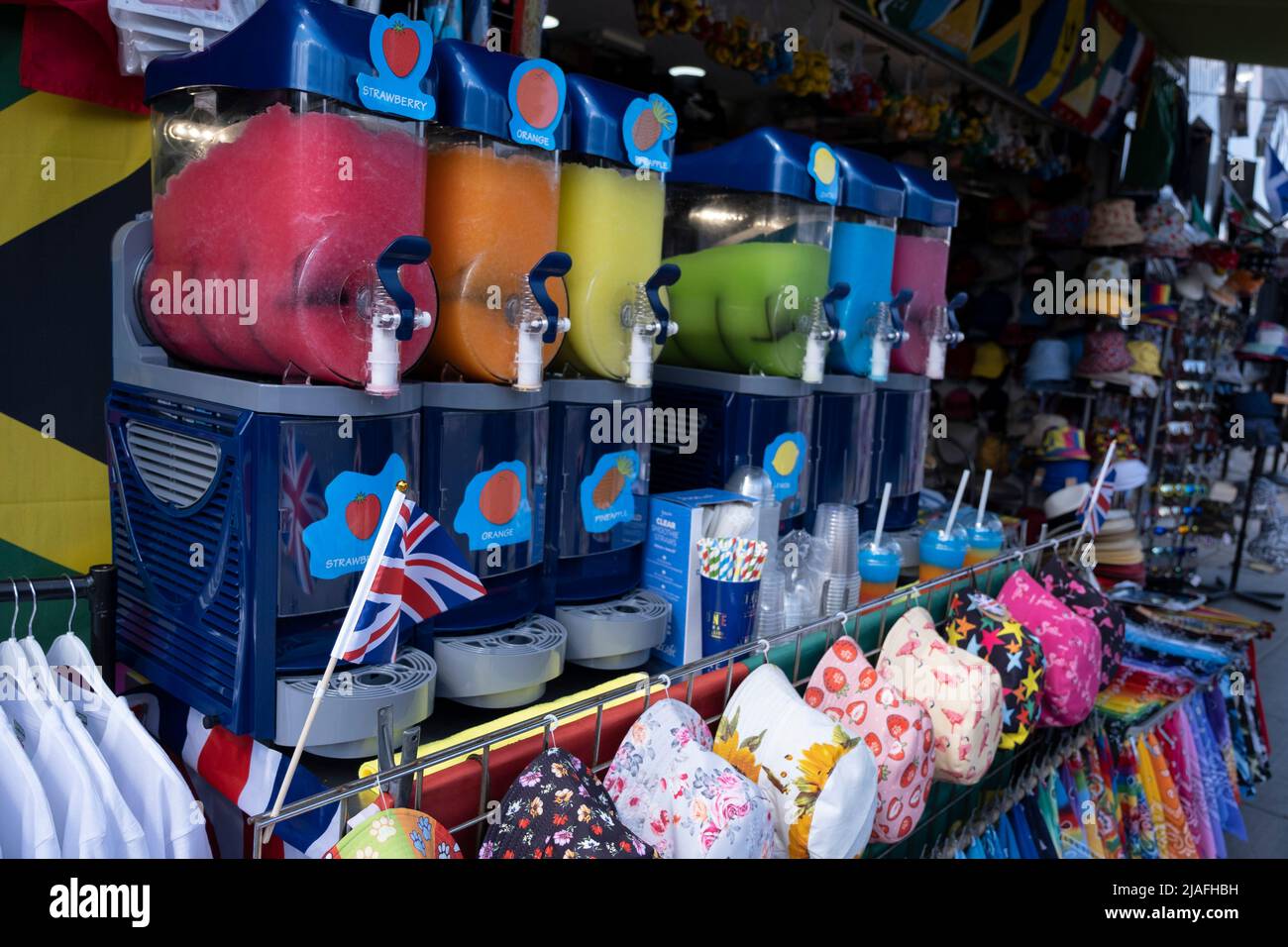 Shop front of small business The Hatman which sells brightly coloured slush drinks in Turnpike Lane, Wood Green on 19th May 2022 in London, United Kingdom. Stock Photo