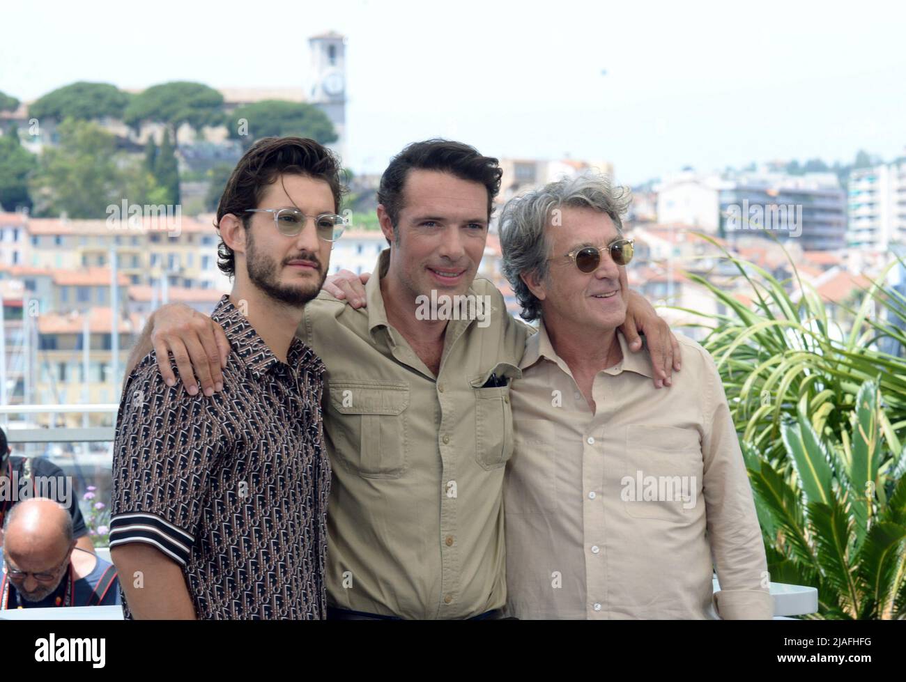 May 28, 2022, CANNES, France: CANNES, FRANCE - MAY 28: Pierre Niney, Nicolas Bedos and FranÃ§ois Cluzet attend the photocall for ''Mascarade'' during the 75th annual Cannes film festival at Palais des Festivals on May 28, 2022 in Cannes, France. (Credit Image: © Frederick Injimbert/ZUMA Press Wire) Stock Photo