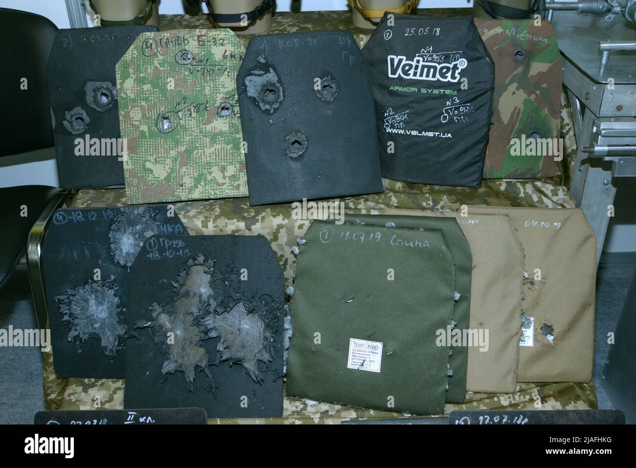 Body armor plates for army bulletproofs with bullet holes put on stand