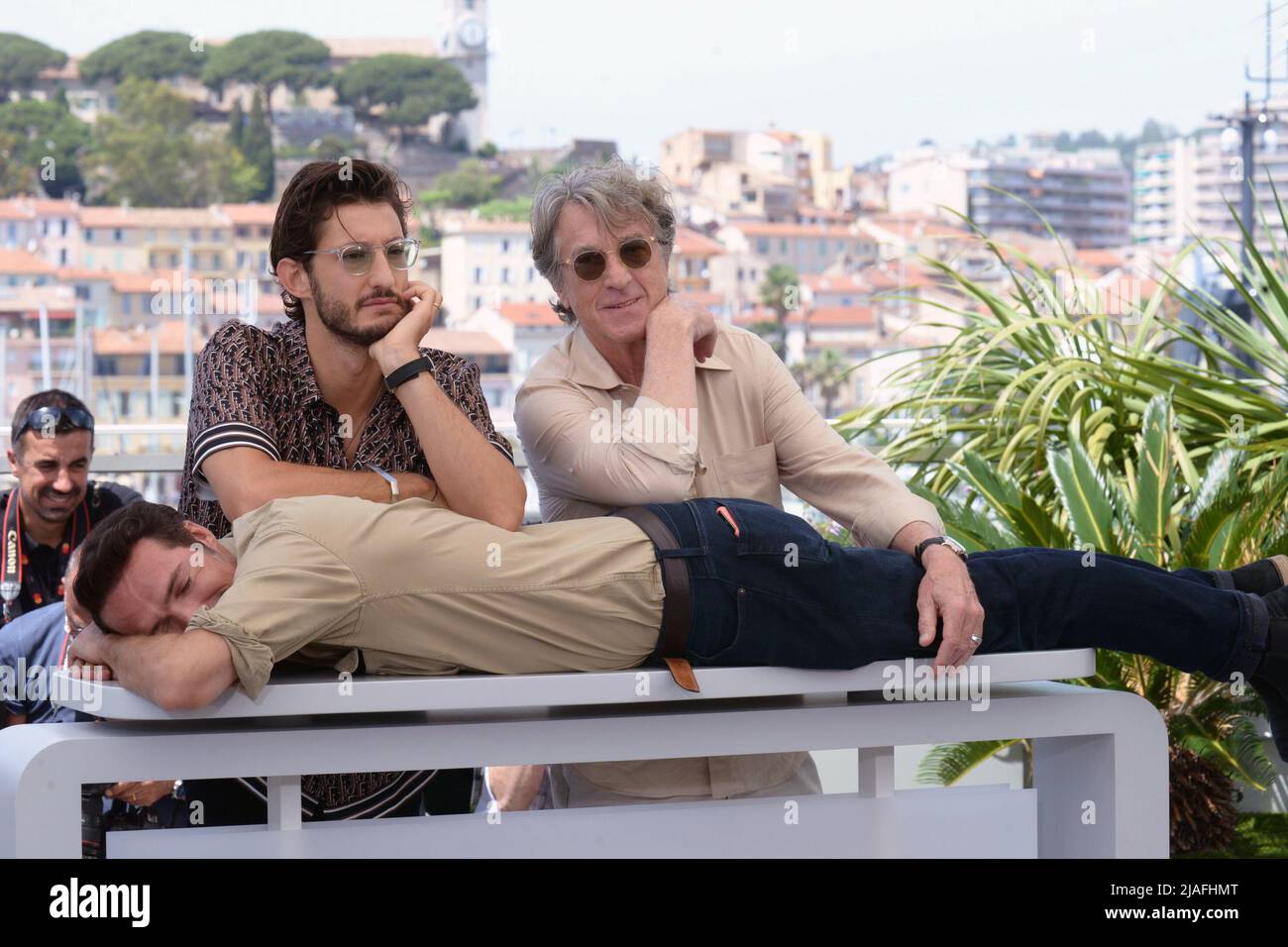 May 28, 2022, CANNES, France: CANNES, FRANCE - MAY 28: Pierre Niney, Nicolas Bedos and FranÃ§ois Cluzet attend the photocall for ''Mascarade'' during the 75th annual Cannes film festival at Palais des Festivals on May 28, 2022 in Cannes, France. (Credit Image: © Frederick Injimbert/ZUMA Press Wire) Stock Photo