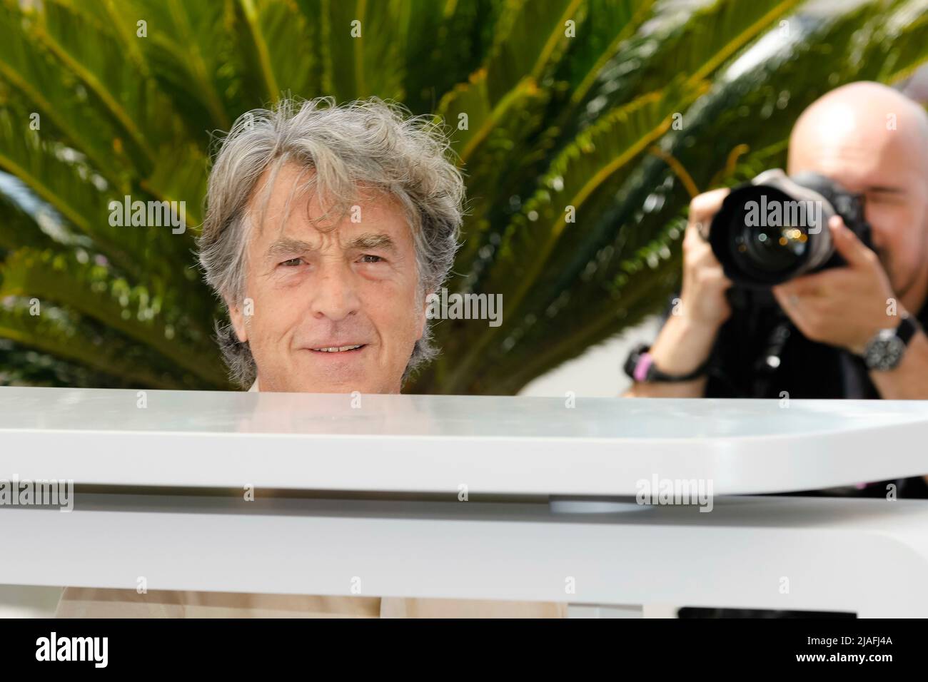Francois Cluzet poses at the photocall of 'Masquerade' during the 75th Cannes Film Festival at Palais des Festivals in Cannes, France, on 28 May 2022. Stock Photo