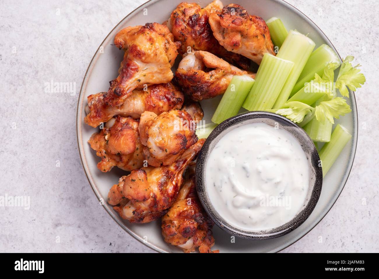 buffalo chicken wings with celery and ranch sauce Stock Photo