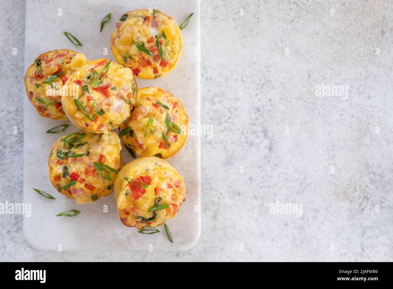 Egg muffins with ham, cheese and vegetables Stock Photo Alamy