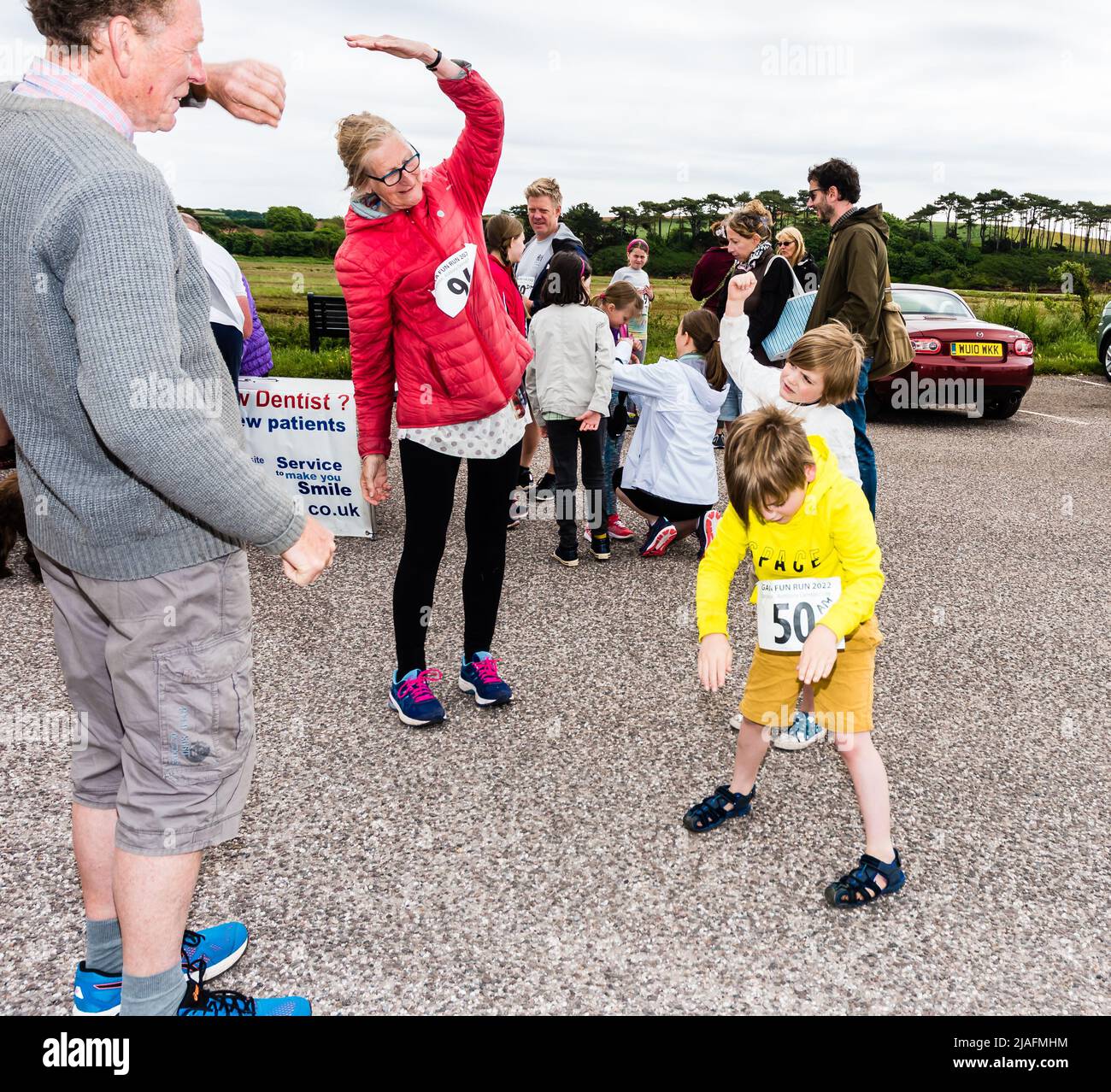 Budleigh Salterton Gala Week Fun Run. Prerace limbering up Stock Photo