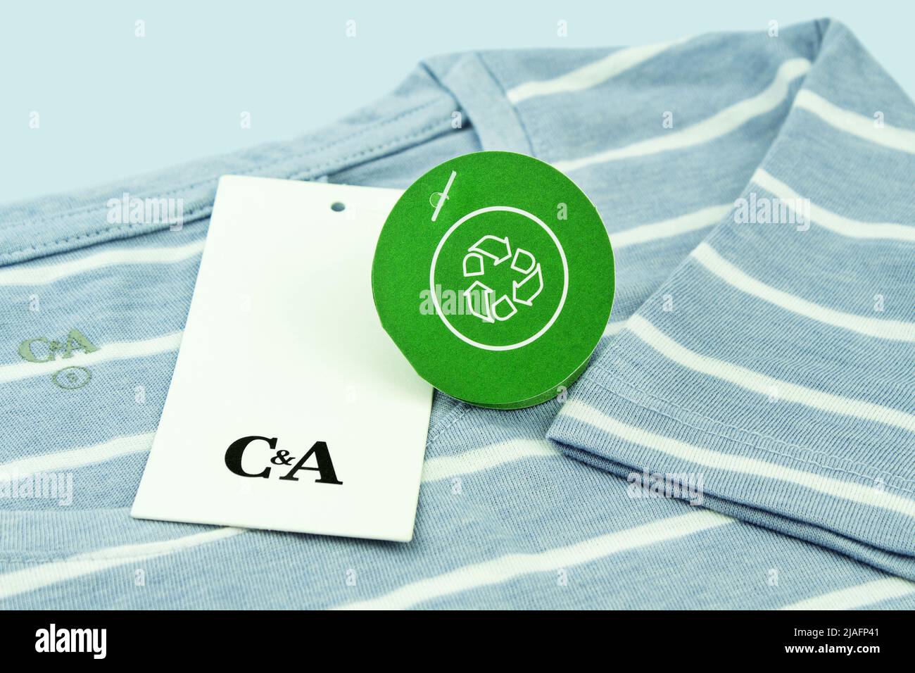 Hamburg, Germany -  May 20  2022:   Fashion and green Polyester Recycling Label C&A with T-Shirt Stock Photo