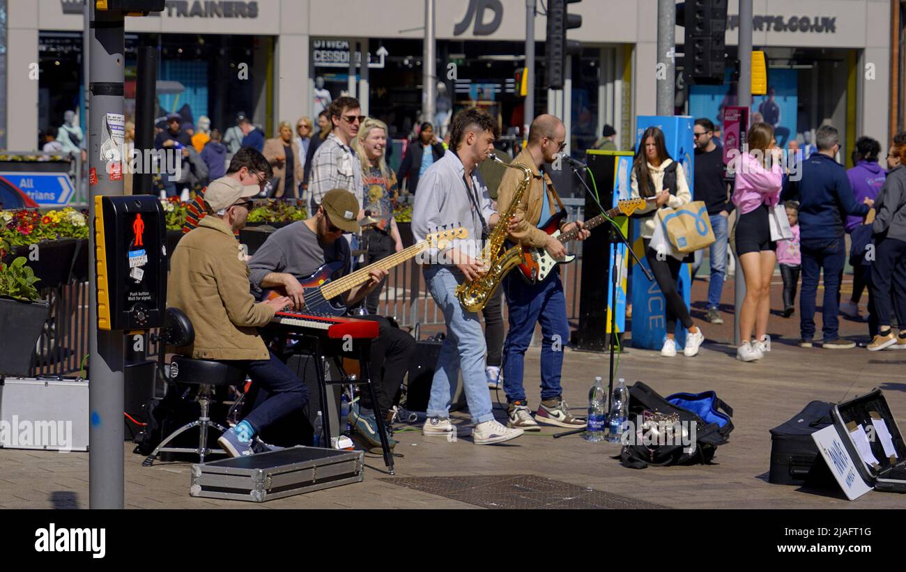 Street musicians busking at Royal Mile in Belfast BELFAST, UK APRIL