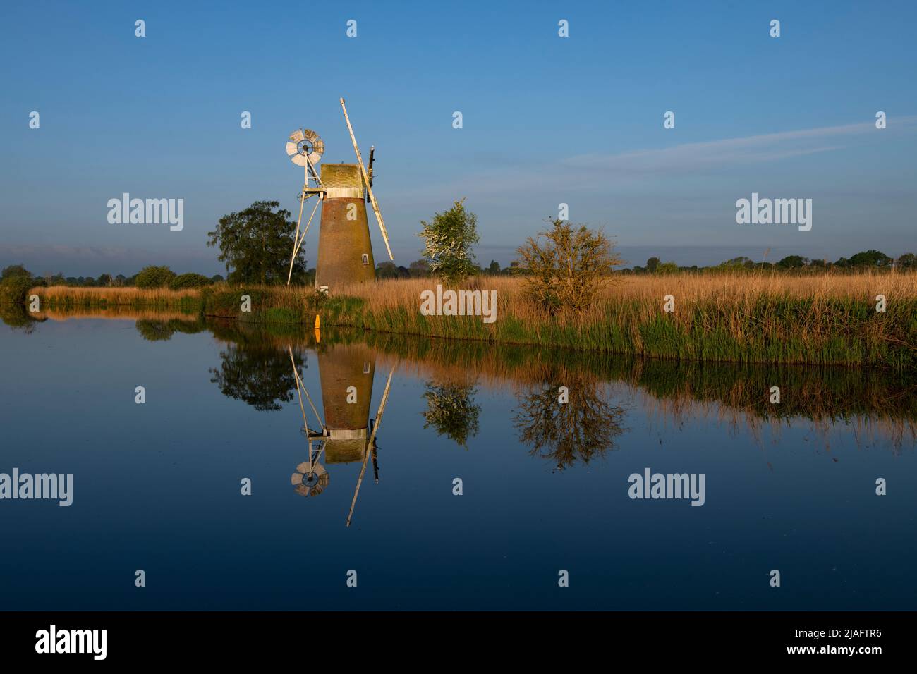 Norfolk Broads Norfolk Dawn England May 2022 Turf Fen Drainage Mill on the River Ant at How Hill on the Norfolk Broads.. The drainage mill was built a Stock Photo