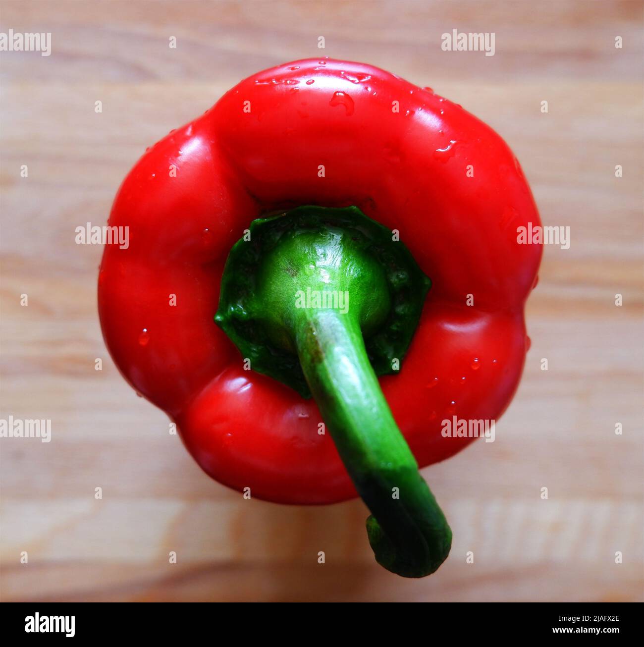 red bell pepper on a chopping board Stock Photo - Alamy